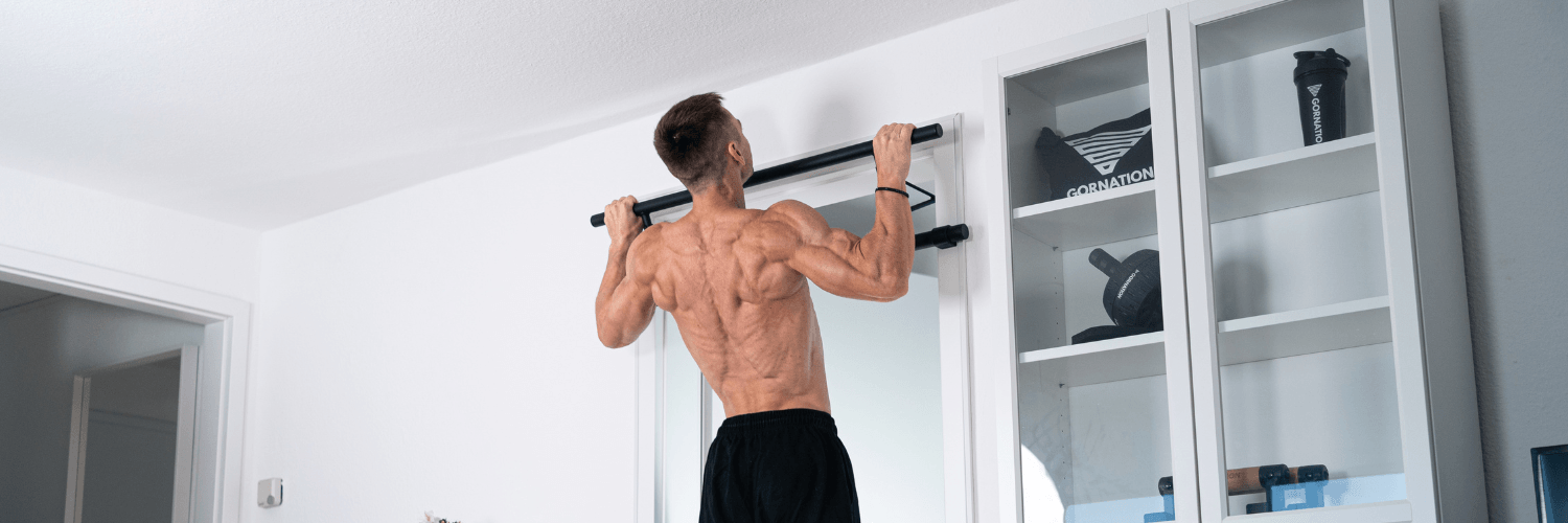GORNATION athlete doing a pull up with a doorway pull up bar from GORNATION