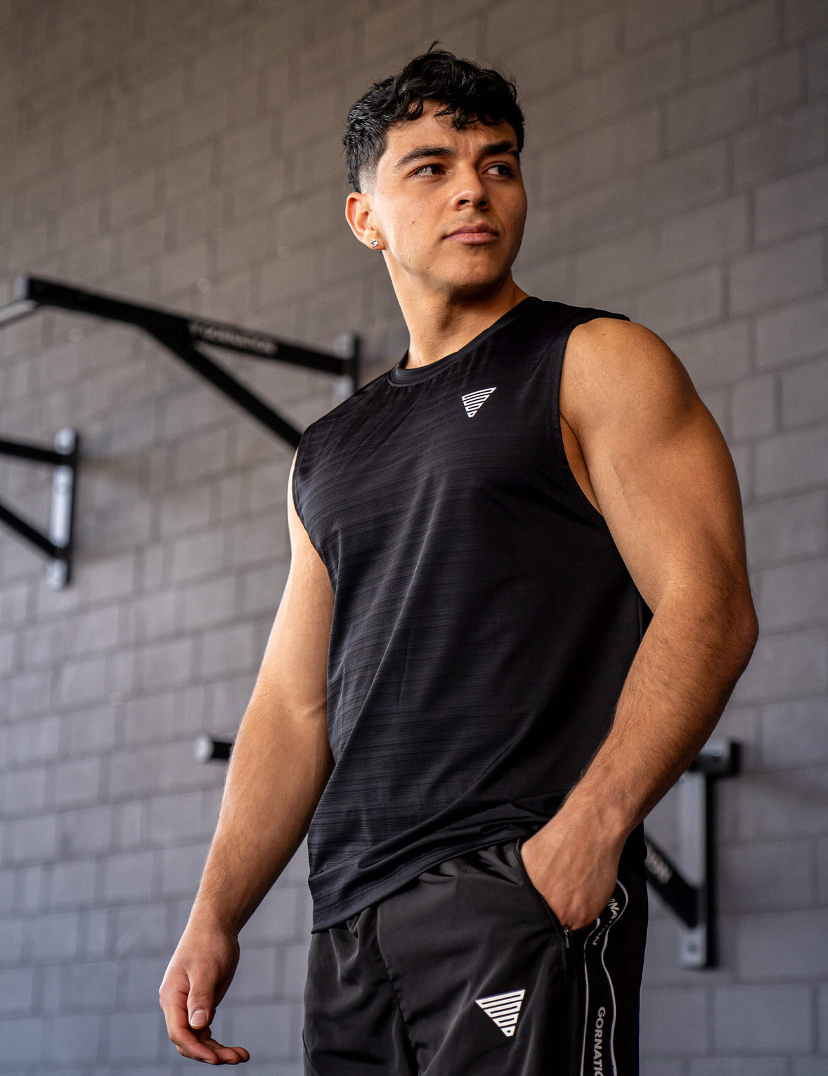 GORNATION athlete wearing the GORNATION active tank top in black