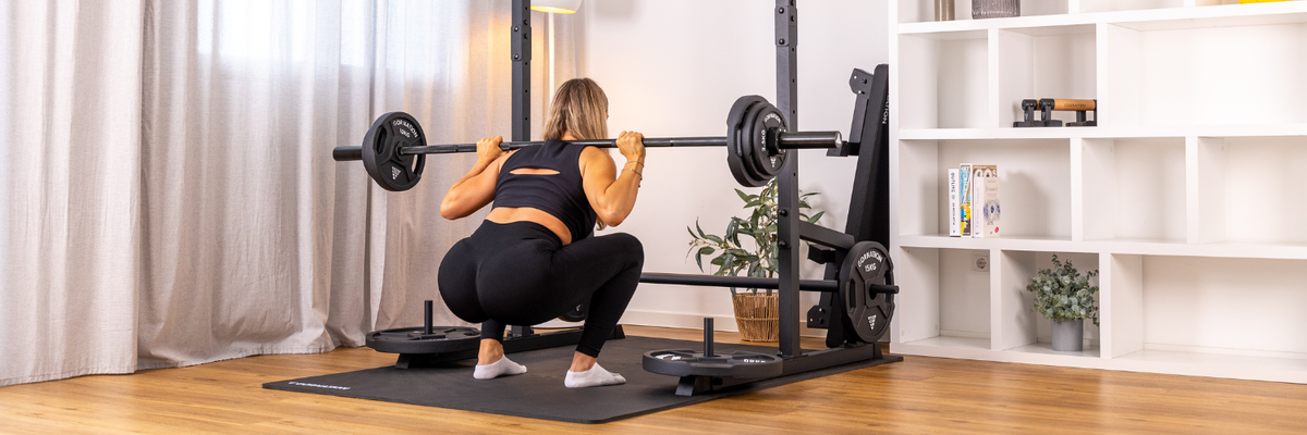 GORNATION athlete doing a squat with a GORNATION barbell