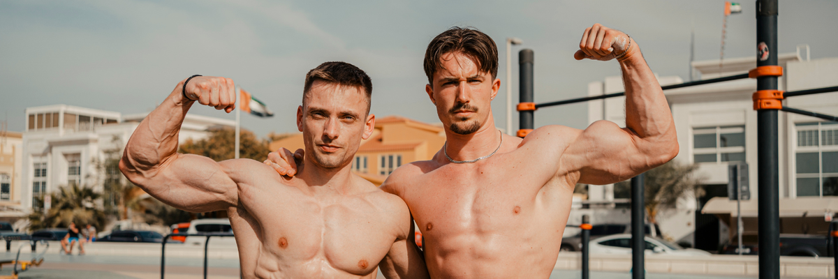 Two GORNATION athetes flexing their biceps