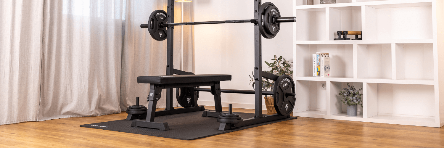 GORNATION Foldable Bench standing in front of the GORNATION Pull Up Station