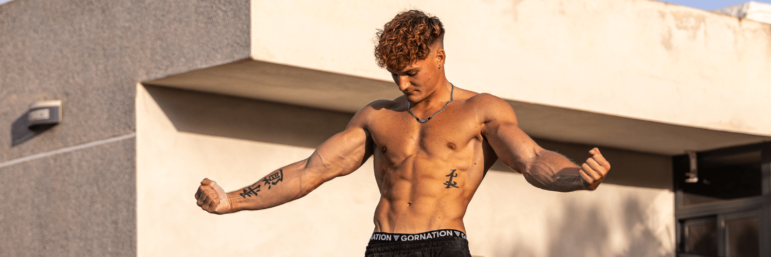 GORNATION athlete flexing in front of a pool