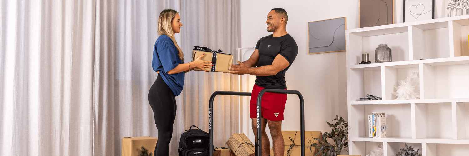 GORNATION athlete handing over christmas presents from GORNATION