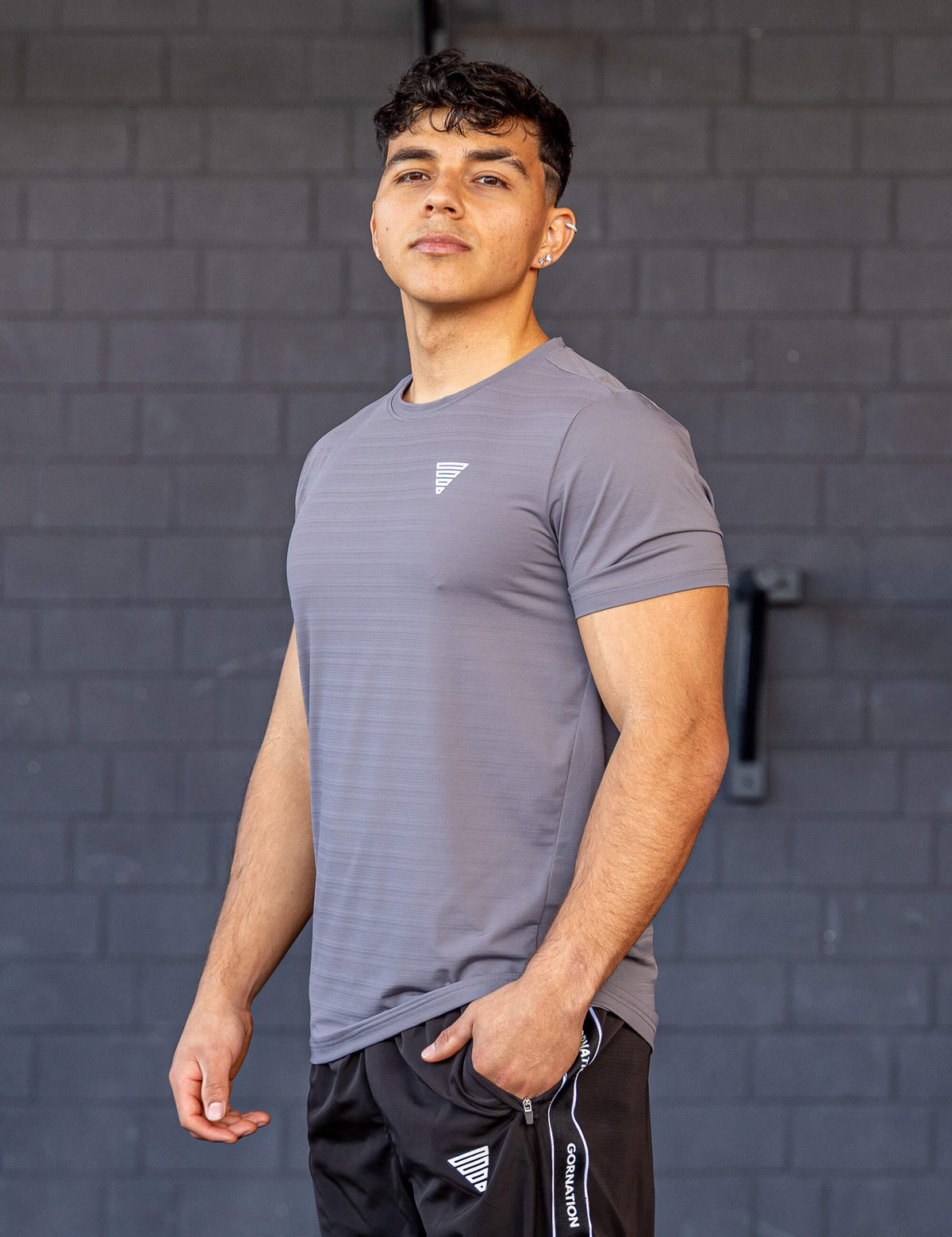 GORNATION athlete wearing the GORNATION active t-shirt in grey