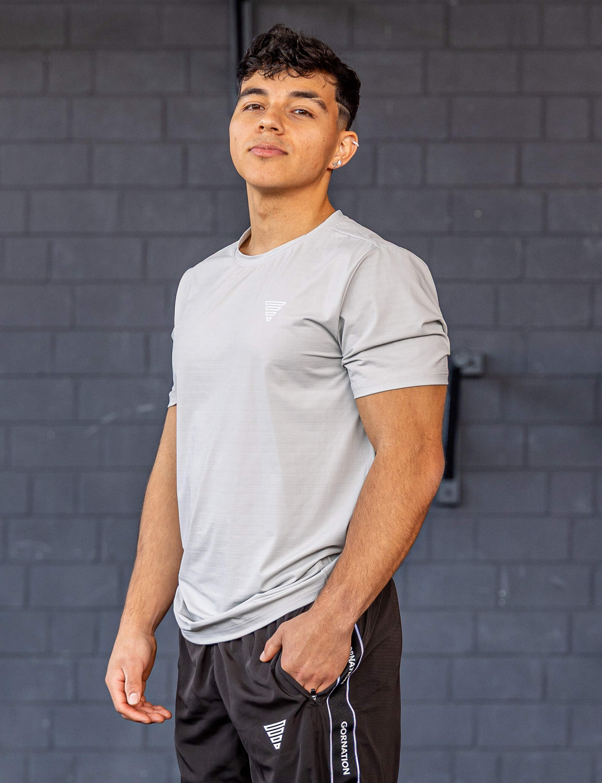 GORNATION athlete wearing the GORNATION active t-shirt in grey